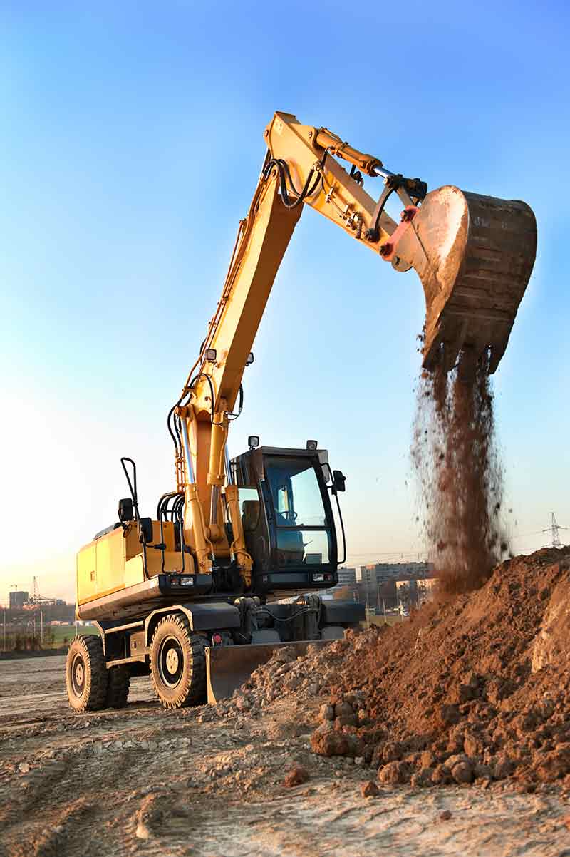 Backhoe Unloading Sands — Earthmoving Repair in Koumala, QLD Backhoe Unloading Sands — Earthmoving Repair in Koumala, QLD